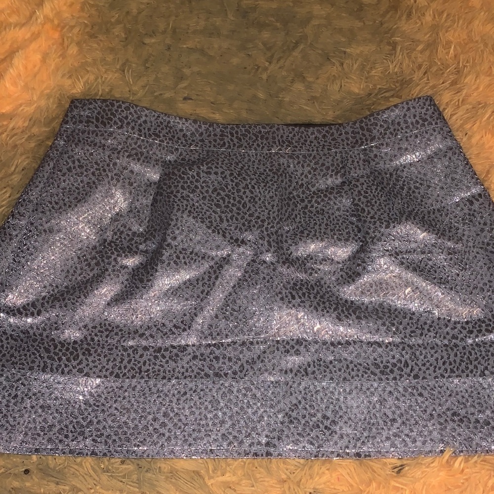 Silver shiny cheetah print mini skirt. Size 12. perfect condition!